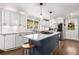 Modern kitchen features an island with marble countertops, stainless steel appliances, and a window view at 504 Kingswood Nw Ln, Atlanta, GA 30305
