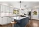 Modern kitchen with stainless steel appliances, a center island, and an open layout into dining area at 504 Kingswood Nw Ln, Atlanta, GA 30305