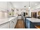White kitchen with granite countertops, stainless steel appliances, and blue island at 504 Kingswood Nw Ln, Atlanta, GA 30305