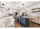 Stylish kitchen with white cabinets, stainless steel appliances, modern island, and granite countertops at 504 Kingswood Nw Ln, Atlanta, GA 30305