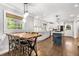 Bright eat-in kitchen features stainless steel appliances, white cabinets, and a blue island at 504 Kingswood Nw Ln, Atlanta, GA 30305