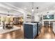 Modern kitchen with stainless steel appliances, a center island, and an open layout into dining area at 504 Kingswood Nw Ln, Atlanta, GA 30305