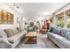 Bright living room featuring two sofas, decorative art, and lots of natural light at 504 Kingswood Nw Ln, Atlanta, GA 30305