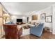 Comfortable living room with hardwood floors, neutral walls, and plenty of seating at 504 Kingswood Nw Ln, Atlanta, GA 30305