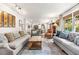 Inviting living room with ample seating, natural light, and a view into the dining area at 504 Kingswood Nw Ln, Atlanta, GA 30305