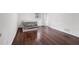 Bright bedroom with dark hardwood floors, neutral paint, and minimalist style at 160 Old Mill Ct, Fayetteville, GA 30214