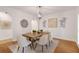 Elegant dining room with a wooden table, stylish chairs, and modern lighting, perfect for entertaining at 160 Old Mill Ct, Fayetteville, GA 30214