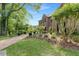 Lovely brick home with brick walkway, green lawn, and professional landscaping at 160 Old Mill Ct, Fayetteville, GA 30214