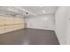 Spacious three car garage with neutral paint, fluorescent lighting, and plentiful space for parking at 160 Old Mill Ct, Fayetteville, GA 30214
