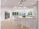Bright, spacious kitchen with white cabinetry, granite countertops, and large windows overlooking the lake at 160 Old Mill Ct, Fayetteville, GA 30214