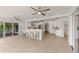 Bright, open kitchen with bar seating, stainless appliances, and sliding door access to the outside at 160 Old Mill Ct, Fayetteville, GA 30214