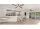 Modern eat-in kitchen with bar seating and sliding glass doors to an outdoor deck area at 160 Old Mill Ct, Fayetteville, GA 30214