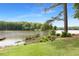 View of lake, trees, and wetlands with a grassy lawn leading to the water at 160 Old Mill Ct, Fayetteville, GA 30214