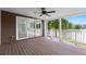Covered back porch with a view of the lake and access to the sun room at 160 Old Mill Ct, Fayetteville, GA 30214