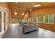 Beautiful sunroom features wood-paneled walls, skylights, ceiling fans, and comfortable seating at 160 Old Mill Ct, Fayetteville, GA 30214