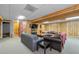 Spacious basement living room with wood paneled walls, comfortable couches, and a flat screen TV at 1690 Cedar Grove Dr, Marietta, GA 30066