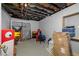 Unfinished basement with exposed ceiling, boxes, and storage solutions, offering potential for customization at 1690 Cedar Grove Dr, Marietta, GA 30066