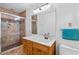 Bathroom featuring a shower, vanity, and towel rack at 1690 Cedar Grove Dr, Marietta, GA 30066
