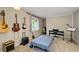 Bedroom with guitars and musical instruments creating a cozy and creative atmosphere at 1690 Cedar Grove Dr, Marietta, GA 30066