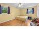 Bright bedroom with hardwood floors, a ceiling fan, and natural light at 1690 Cedar Grove Dr, Marietta, GA 30066