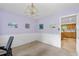 Bedroom featuring carpet, walk-in door, and view to kitchen at 1690 Cedar Grove Dr, Marietta, GA 30066