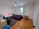 Comfortable bedroom with hardwood floors, a ceiling fan, and a cozy atmosphere at 1690 Cedar Grove Dr, Marietta, GA 30066