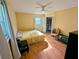 Comfortable bedroom with hardwood floors, ceiling fan, and lots of natural light at 1690 Cedar Grove Dr, Marietta, GA 30066