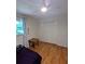 Bright bedroom features hardwood floors and ample closet space at 1690 Cedar Grove Dr, Marietta, GA 30066