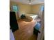 Sunlit bedroom with hardwood floors, neutral walls, and two windows for natural light at 1690 Cedar Grove Dr, Marietta, GA 30066