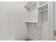 Walk-in closet with white shelving and hanging rod at 1690 Cedar Grove Dr, Marietta, GA 30066