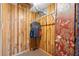 Unfinished closet in a basement with wood paneling, a clothes rack, and storage potential at 1690 Cedar Grove Dr, Marietta, GA 30066