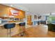 Charming kitchen with hardwood floors, breakfast bar and connected living area at 1690 Cedar Grove Dr, Marietta, GA 30066