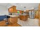 Open concept kitchen featuring a breakfast bar, stainless steel appliances, and hardwood floors at 1690 Cedar Grove Dr, Marietta, GA 30066
