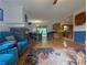 Open-concept living space featuring a brick fireplace, adjacent dining area, and breakfast bar to the kitchen at 1690 Cedar Grove Dr, Marietta, GA 30066