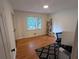 Bright office with hardwood floors, natural light, and built-in shelving at 1690 Cedar Grove Dr, Marietta, GA 30066