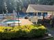 Community Pool with large pool, pool, chairs, umbrellas, restrooms, and picnic tables at 1690 Cedar Grove Dr, Marietta, GA 30066