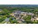 Scenic aerial view of a community featuring a pond and lush green trees at 2043 Mason Mill Rd, Decatur, GA 30033