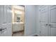Entryway to a bathroom with double doors and white cabinets at 2043 Mason Mill Rd, Decatur, GA 30033