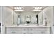 Bathroom featuring a double vanity with white countertops, large mirror, and recessed lighting at 2043 Mason Mill Rd, Decatur, GA 30033
