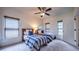 Bedroom features two beds, with a ceiling fan, and has 2 windows with light-blocking shades at 2043 Mason Mill Rd, Decatur, GA 30033