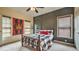 Bedroom with decorative gray wall trim, ceiling fan, and two windows that bring in natural light at 2043 Mason Mill Rd, Decatur, GA 30033