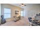 Bedroom with a ceiling fan, a desk with computer and an office chair, and a grey armchair at 2043 Mason Mill Rd, Decatur, GA 30033