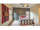 Charming bedroom with a black and white themed decor, ceiling fan, and a large window at 2043 Mason Mill Rd, Decatur, GA 30033
