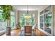 Bright breakfast nook with large windows, a round table, and a view of the outdoors at 2043 Mason Mill Rd, Decatur, GA 30033