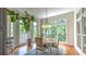 Sun-drenched breakfast nook with large windows offering scenic views and hardwood flooring at 2043 Mason Mill Rd, Decatur, GA 30033