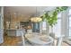Inviting dining area adjacent to kitchen with large windows and plant at 2043 Mason Mill Rd, Decatur, GA 30033