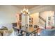 Spacious dining room with stylish seating, hardwood floors, and a modern chandelier at 2043 Mason Mill Rd, Decatur, GA 30033
