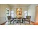 Dining room with a large table, upholstered chairs, and stylish decor, illuminated by a chandelier at 2043 Mason Mill Rd, Decatur, GA 30033