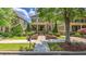 Lovely home featuring a brick facade, covered front porch, and a meticulously landscaped front yard at 2043 Mason Mill Rd, Decatur, GA 30033