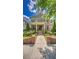 Attractive home with brick facade, inviting front porch, mature landscaping, and manicured lawn at 2043 Mason Mill Rd, Decatur, GA 30033